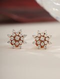 Pair of diamond earrings on a light background