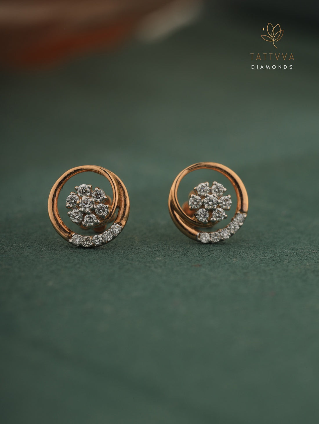 Rose gold earrings with diamond accents on a green background, branded 'Tattvva Diamonds'.